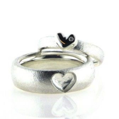 Billede af Ringe sølv, herrering 7,2 mm., damering 3,9 mm. med brill. 0,01 w/vs.